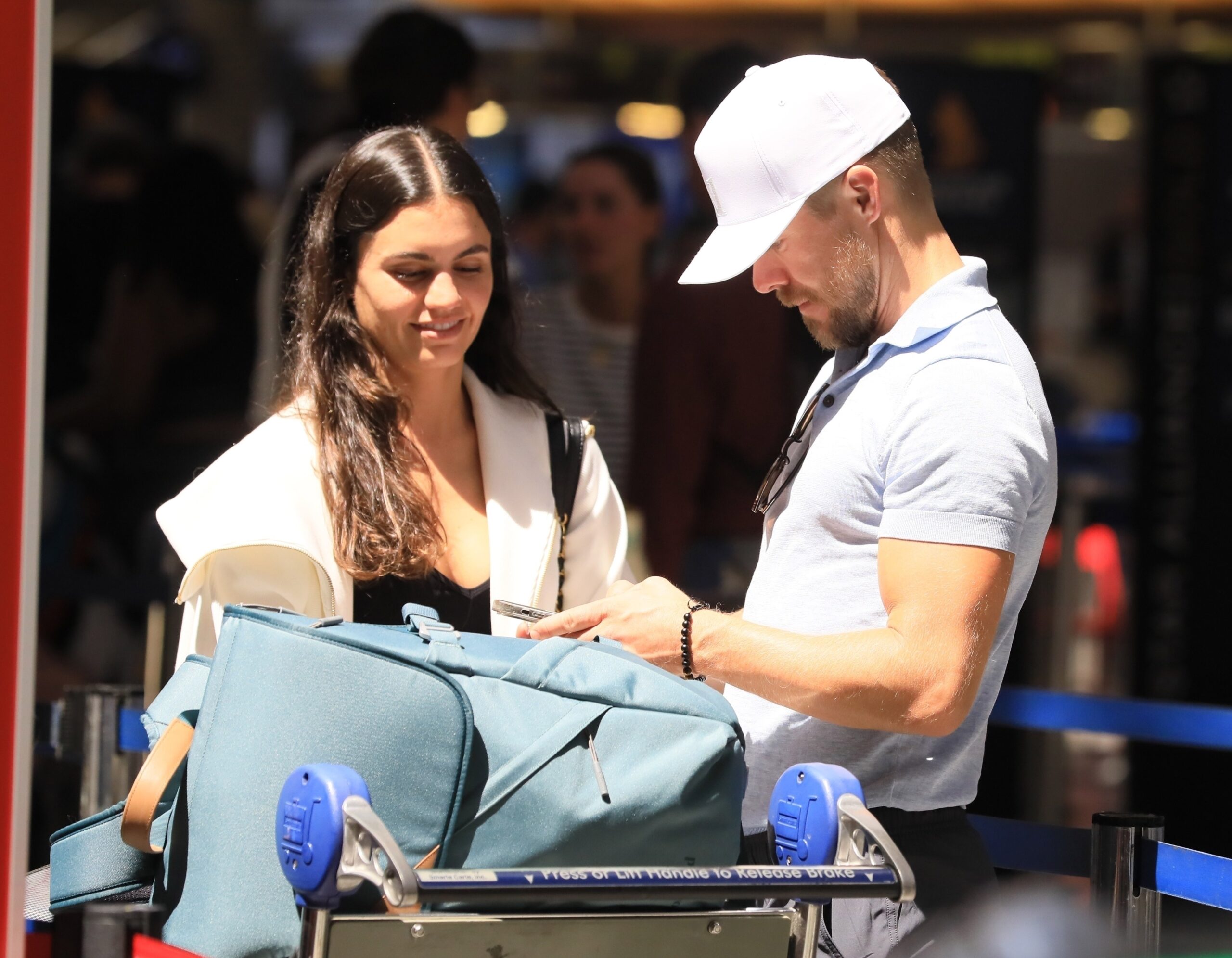 Newlyweds Derek Hough and Hayley Erbert pack on the PDA at LAX following fairy-tale wedding