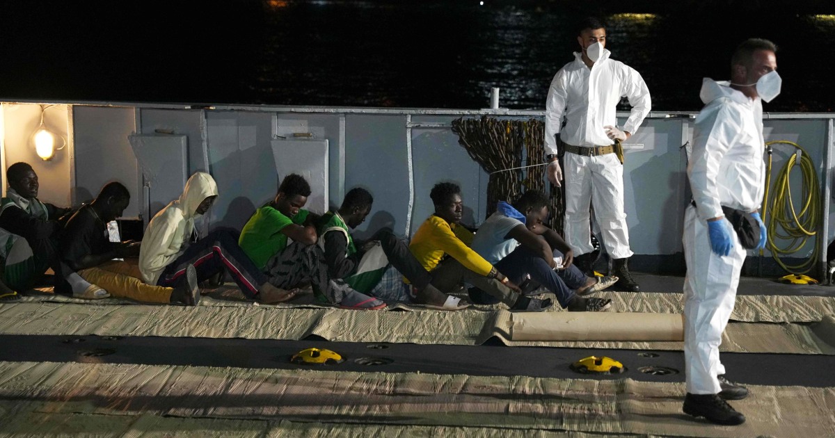 E.U. pledges crackdown on ‘brutal’ migrant smuggling during visit to overwhelmed Italian island