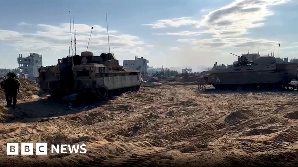 Tank seen on key Gaza road as Israeli forces push deeper into north